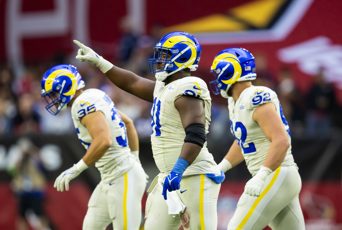 Nov 26, 2023; Glendale, Arizona, USA; Los Angeles Rams defensive tackle Kobie Turner (91) celebrates a play against the Arizona Cardinals at State Farm Stadium.